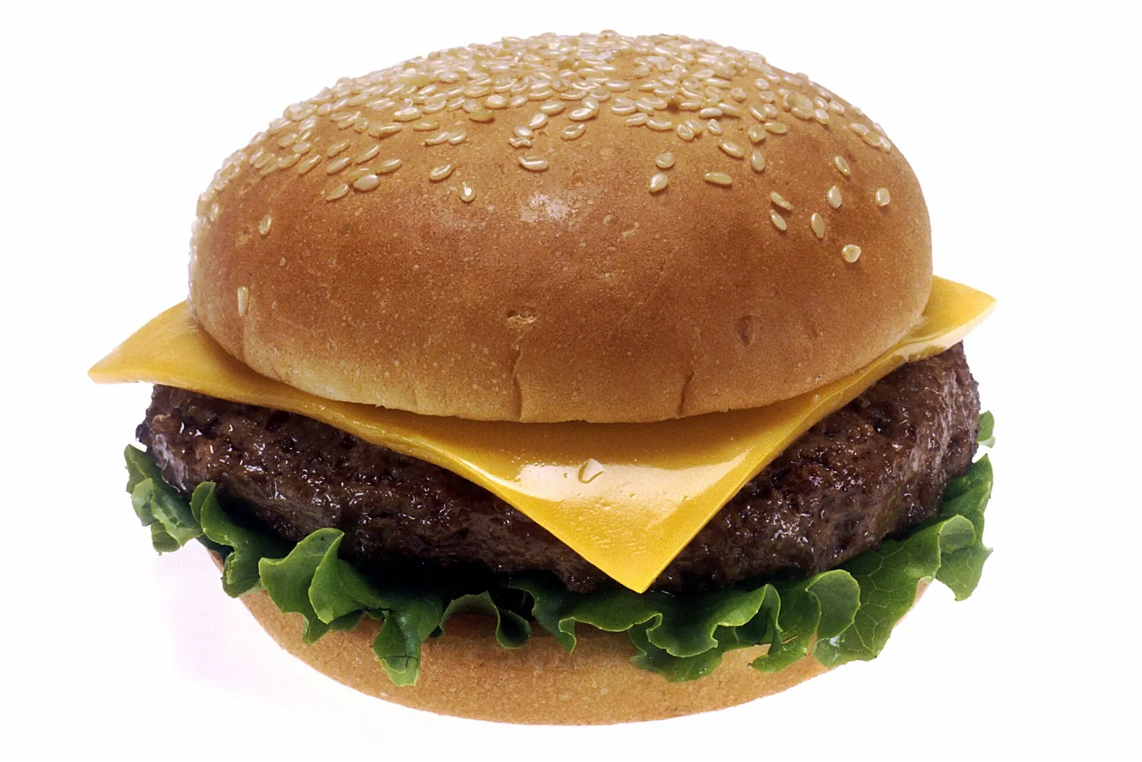 A cheeseburger with a slice of melted American cheese over the patty