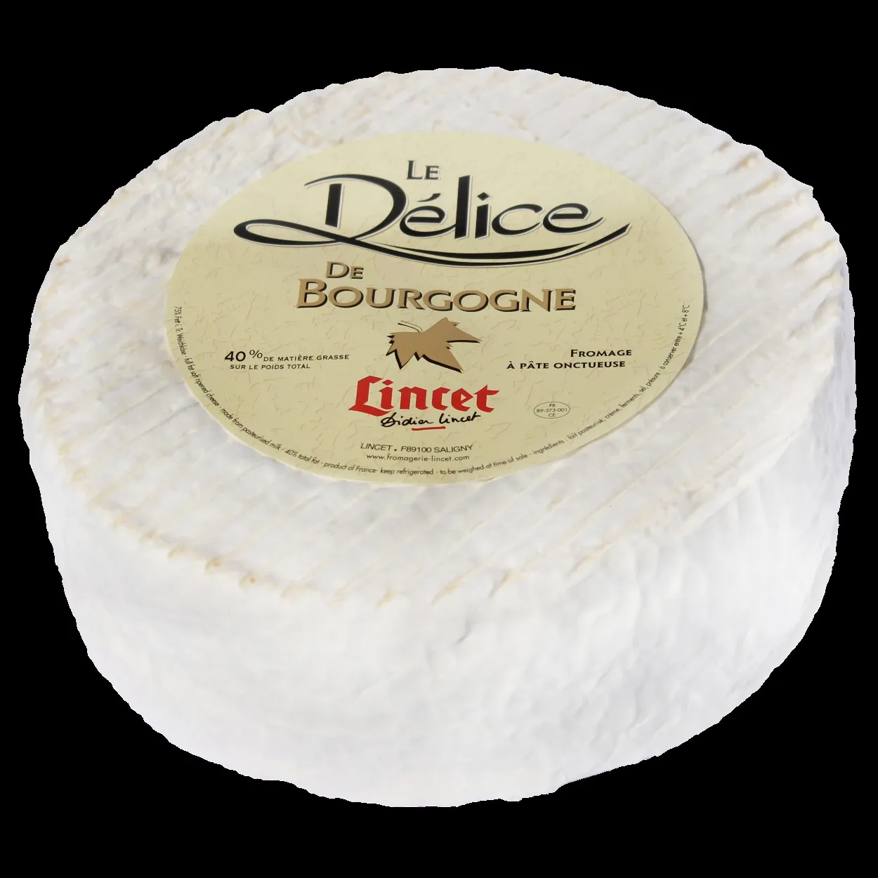 A whole Delice de Bourgogne triple cream cheese with a white bloomy rind and round label on top, on black
