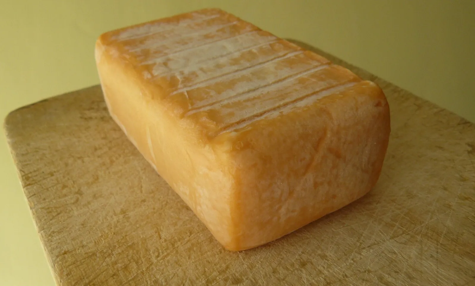 A block of Limburger with its sticky orange-brown rind