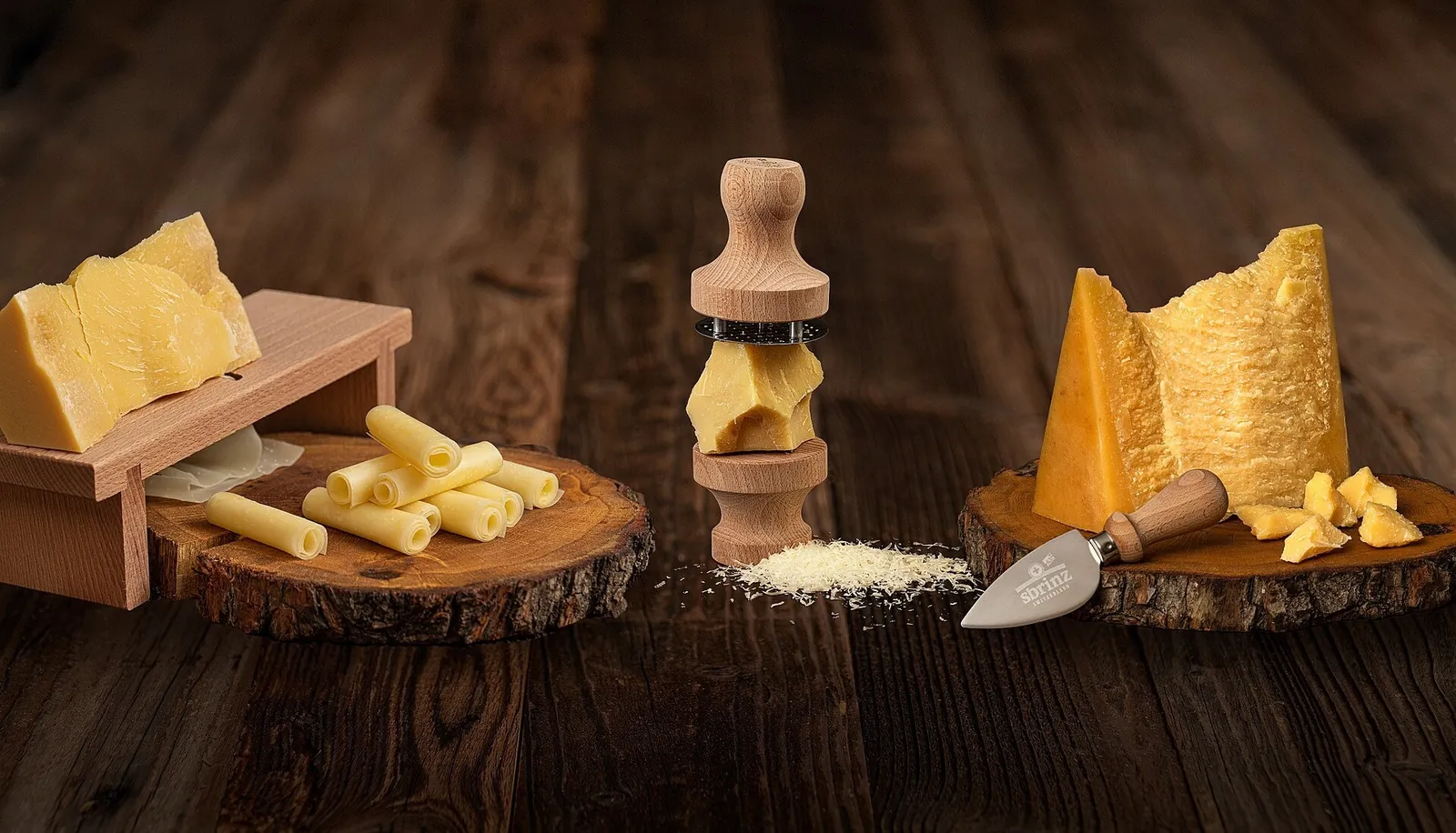 Pieces of Sbrinz cheese, curled shavings and small chunks with a hard golden paste, arranged on small wooden boards
